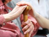 Senior woman with her caregiver at home